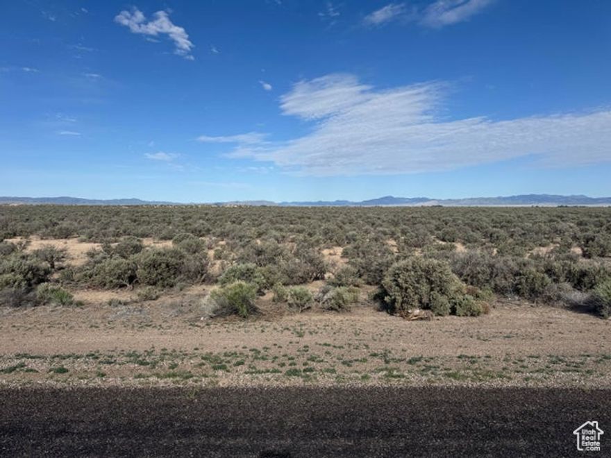 Seller Financing Available with 10% Down. Come own 28.50 acres right on the corner of Beryl Highway and 4000 North. Paved road along Beryl Highway with easy year round access. Could potentially be rezoned for commercial use. Has 3 phase power on the corner of the property. This is two connecting parcels totaling 28.50 acres. Parcel 1 - #E-1306-0007-0000 18.50 Acres Parcel 2 - #E-1306-0004-0000 10.00 Acres Multiple uses might include residential or commercial. Build a home, build a cabin, bring your toys/trailers/campers/RV's and make it a family base camp. Close to Newcastle Reservoir, Enterprise Reservoir, Quick Access to Hamlin Valley Mountains. Only 20 minutes to Enterprise for food, grocery, gas, medical, dental, hardware, restaurants, schools. 50 minutes to St. George/Cedar City. Under 3 hours to Las Vegas. Come see it.