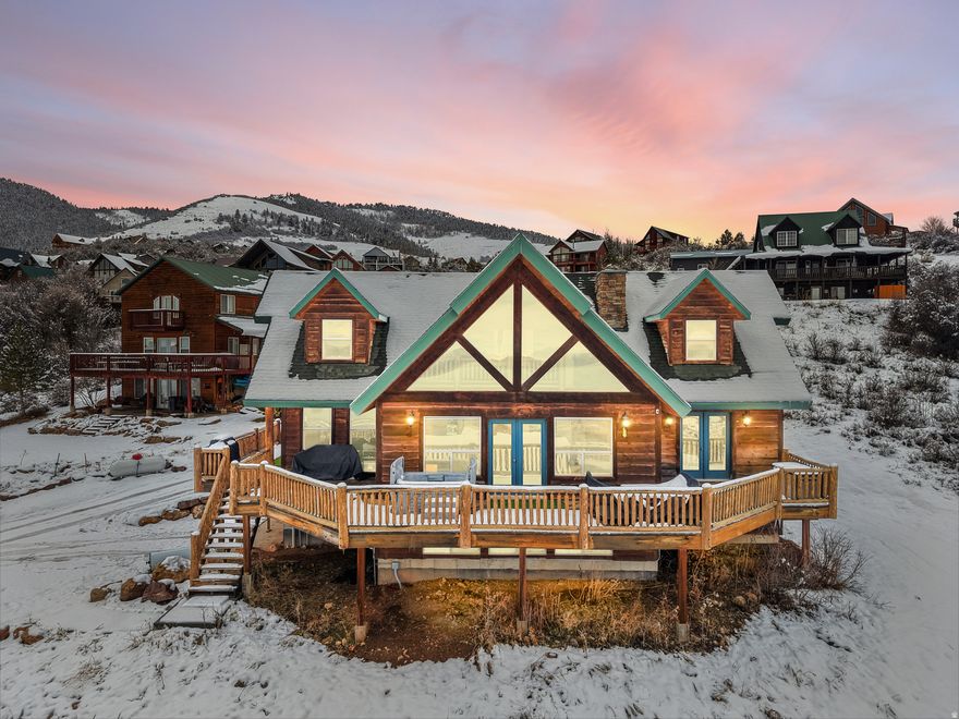 This comfortable 5-bedroom, 3-bath home offers over 3,600 sq. ft. of space and is designed to take full advantage of the incredible lake views. Large windows bring in tons of natural light and showcase the beauty of Bear Lake from the moment you walk in. Two brand-new garages are currently being built on the property-great for storing boats, ATVs, or extra vehicles. The home also comes with the adjoining lot, giving you extra space and ensuring your views will stay open and unobstructed. Whether you're looking for a vacation retreat or a full-time place to call home, this property is a solid fit. Enjoy the peaceful setting, easy access to Bear Lake West amenities, and the year-round recreation the area is known for.