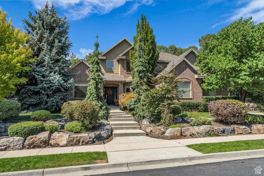 Stunning 6-Bedroom, 3.5-Bath Home with Mountain Views in Prestigious Highland Neighborhood! Nestled in a quiet, double-ended cul-de-sac, this meticulously maintained home offers the perfect blend of luxury and comfort in one of Highland's most sought-after neighborhoods. Situated on a private half-acre wooded lot with a treed slope, the property features a large play yard at the top and is fully fenced for privacy and security. Enjoy convenient RV parking and an oversized 3-car garage for all your storage and vehicle needs. Step inside to find a spacious, open-concept design with vaulted ceilings and an abundance of natural light. The formal living room and study provide ample space for relaxation and work. The gourmet kitchen features a walk-in pantry, perfect for culinary enthusiasts, while the family room provides a cozy place to gather. The main level also includes a large laundry room also used as a craft room, and plenty of storage cabinets throughout, offering both functionality and convenience. The luxurious primary suite is a private retreat with its own en-suite bath and walk-in closet. Picturesque views of the wooded yard provide tranquility and privacy. Upstairs, the home continues to impress with a reading loft, complete with built-in bookshelves, and three generously sized bedrooms. A full bathroom with a laundry chute adds extra convenience. Open & airy throughout this level provide an airy, spacious feel, while the mountain views are simply breathtaking. The fully finished basement boasts a large family room with a kitchenette, two additional bedrooms, and a full bathroom. Additionally, an office, shelved storage room, and fitness room offer versatility for any lifestyle. For added privacy and convenience, the basement includes a separate entrance from the third-car garage bay, and outside entrance. This well-cared-for home is within walking distance to the renowned Alpine Golf Course and the scenic Highland Glen Park and Pond, making it the perfect spot for outdoor enthusiasts and nature lovers. Whether you're looking to relax in your private sanctuary or explore the surrounding natural beauty, this home has it all. Don't miss the opportunity to make this beautiful Highland home yours!   Included: Play set in yard, 3 drinking fountains, tv's in fitness room, laundry/craft room, kitchen bar stools, garage fridge, garage shelves & bike hooks, in-home humidifier system, water softener and radon mitigation system.
