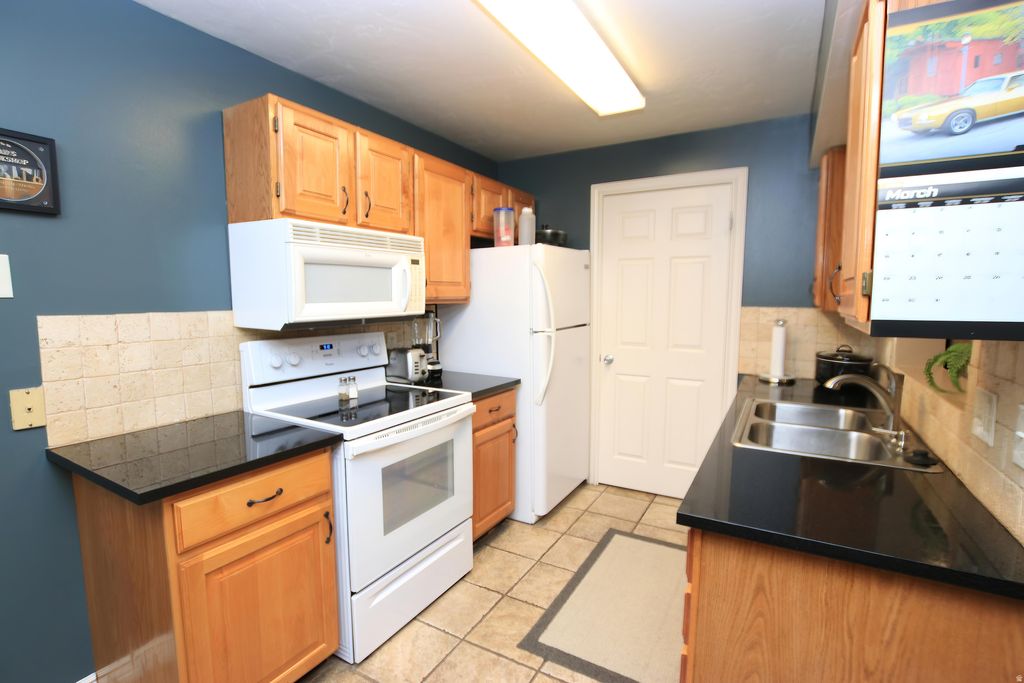 Photo of 4196 S OAK MEADOWS DR W #21, Taylorsville, UT 84123 (MLS # 2147257)