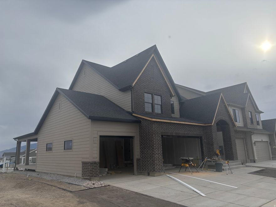 LOT#118A.  This 'Rose' floor plan by Symphony Homes is a spacious 2-story with modern appeal, lots of upgrades throughout, and classy interior design and finishes! Large galley kitchen, walk-in pantry, 36" gas cooktop, double ovens, and dining nook. Family room features a fireplace and large windows for plenty of natural light. Entry is open to upper level loft, and the loft area is spacious enough to put a desk. Primary suite features a dual vanity, oversized garden tub, separate shower, and a huge walk-in closet with custom built-ins. Finished basement with large family/game room, 1 large bedroom with a walk-in closet and spacious bathroom! Large covered deck, upgraded insulation, LVP flooring, lots of storage space throughout. Secondary water. Community has common area with a playground, and walking trails that border the community. Price includes full landscaping. Esimated completion is June.