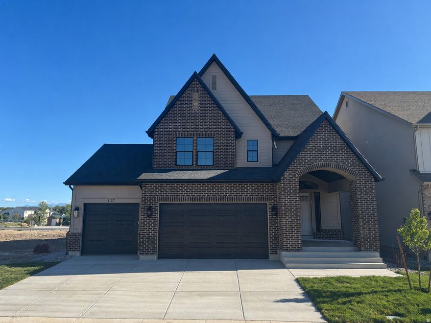 LOT#118A.  This 'Rose' floor plan by Symphony Homes is a spacious 2-story with modern appeal, lots of upgrades throughout, and classy interior design and finishes! Large galley kitchen, walk-in pantry, 36" gas cooktop, double ovens, and dining nook. Family room features a fireplace and large windows for plenty of natural light. Entry is open to upper level loft, and the loft area is spacious enough to put a desk. Primary suite features a dual vanity, oversized garden tub, separate shower, and a huge walk-in closet with custom built-ins. Finished basement with large family/game room, 1 large bedroom with a walk-in closet and spacious bathroom! Large covered deck, upgraded insulation, LVP flooring, lots of storage space throughout. Secondary water. Community has common area with a playground, and walking trails that border the community. Price includes full landscaping. Esimated completion is June.