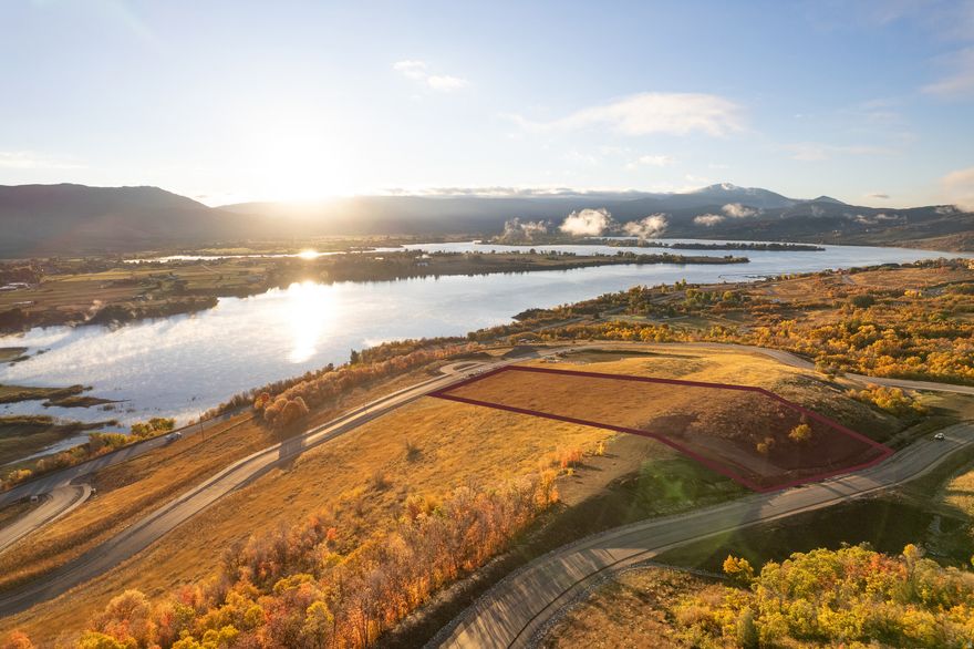 Osprey Ranch Lot 2 presents a rare opportunity to secure a fully improved 5.06 acre ridge top homesite showcasing commanding lake and mountain views, with water and sewer connected. Set to capture panoramic vistas across the water and surrounding peaks, this expansive parcel offers both privacy and presence, creating an ideal setting for a custom legacy residence that embraces indoor/outdoor living in every season. Four season recreation surrounds you, from boating and beach days at Pineview to private trail access within Osprey Ranch for hiking and mountain biking, while winter places you minutes from the slopes of Powder Mountain, Snowbasin Resort, and Nordic Valley Ski Resort. Lot 2 delivers scale, infrastructure, and extraordinary lake views within one of Ogden Valley's most compelling mountain communities. Boundary lines are provided as courtesy only. Buyer is advised to obtain independent measurements.