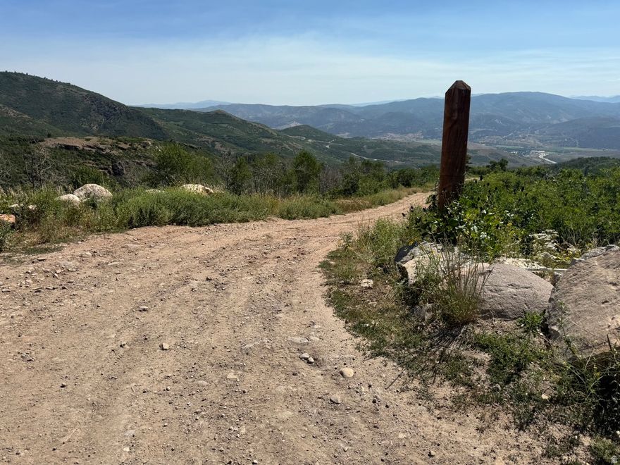 Large parcel, 39.80 acres, of land offering incredible mountain views just minutes from Park City's world-class ski resorts, lakes for boating, and top shopping and dining.  This rare property is perfect for your dream home, vacation retreat, or private estate. Enjoy year-round outdoor recreation: skiing, hiking, fishing, and more in a peaceful, natural setting.  This is a property owners dream.  Your choice to join the HOA or remain separate and still have the road access year round.   Stubbed electrical from Rocky Mountain Power near the head of the driveway and If you choose to join the HOA you can connect into the water near the head of the driveway.  Fire department standard 5000 gallon concrete water tank is on property.  Land available to build. Borders Blue Sky Ranch.  Hunting property.  One building on property, approximate size 24'x24' three sided barn. At the end of plow route.  All measurements are provided as an estimate only, buyer is responsible for verifying all information. It is not appropriate to view the property without an agent.