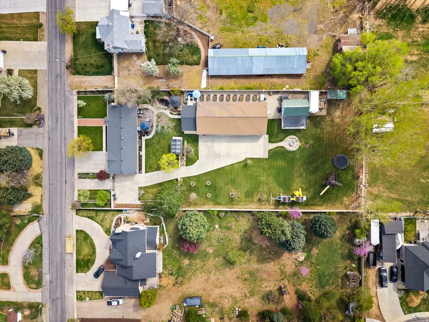 Ready to host some great summer fun?  Look at this incredible outdoor kitchen!  Like to work on cars or have lots of toys?  There is a work shop for that too (30'x70' and fully heated, bathroom, plumbed for compressed air, all the works so you could practically live there if you wanted to) !  RV Parking,  Large patio area to host events or have movie nights,  2 play areas including a pirate ship!  A barn for the horse,  Vegetable gardens in raised beds,  A green house that can double as an office or studio, Hot tub for 5,   Fire pit with lots of seating,  Gazebo with a porch swing, and a pond water feature.  You will have so much fun and make so many memories here!   Come on, when do you get to buy a house with a pirate ship included??   Inside everything has been remodeled and looks top notch.  Includes water shares and animal rights.  Look for the 3D virtual tour on the mls and come see in person. Definately one to put on your radar!  Information is provided as a courtesy estimate only. Buyer and/or buyer's agent are advised to independently verify all information.  Agent related to seller