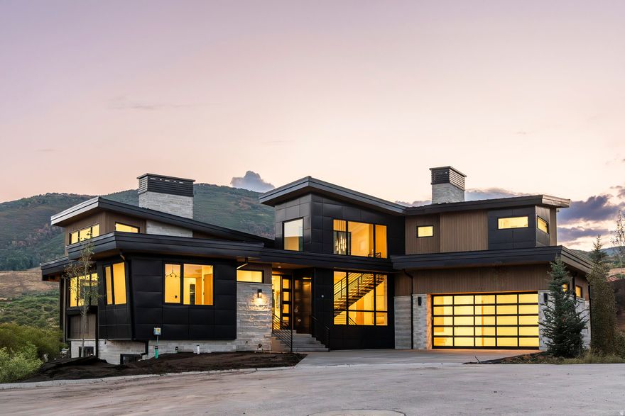 Step into elevated mountain living at 1717 Centaur Court in SkyRidge, a newly built 5,361 sq ft modern mountain retreat designed by Moxie Design and crafted by Aecum Development. This 6-bedroom, 8-bathroom sanctuary was thoughtfully designed to embrace expansive views of Mayflower, Jordanelle Reservoir, and Deer Valley East ski runs through walls of glass in every room. Created for year-round living and entertaining, the home features a chef's kitchen with cabinet-paneled appliances, a kitchen island with custom milled waterfall edge, dual dishwashers, and custom cabinetry, all flooded with natural light. Expansive gathering spaces flow seamlessly to view-filled terraces, while the private primary suite crowns the upper level with its own rooftop patio facing hundreds of acres of ski terrain. The floor plan offers ultimate flexibility: two bedroom suites on the main level (one perfect as a home office), and three additional suites downstairs alongside a large game room with a wet bar. Details such as a heated driveway, custom lighting, and refined finishes elevate the sophistication of the home. As part of the premier SkyRidge community, residents enjoy direct access to the new Deer Valley East expansion, complete with a planned resort base offering dining, ski shops, and shuttle access. Outdoor adventure awaits just minutes away with boating at Jordanelle, equestrian facilities, golf, and miles of scenic hiking and biking trails-all within easy reach of Park City, Salt Lake City, and the Heber Valley. Purposefully priced below comparable homes in the community, this residence delivers luxury, adventure, and serenity-the ultimate mountain lifestyle.