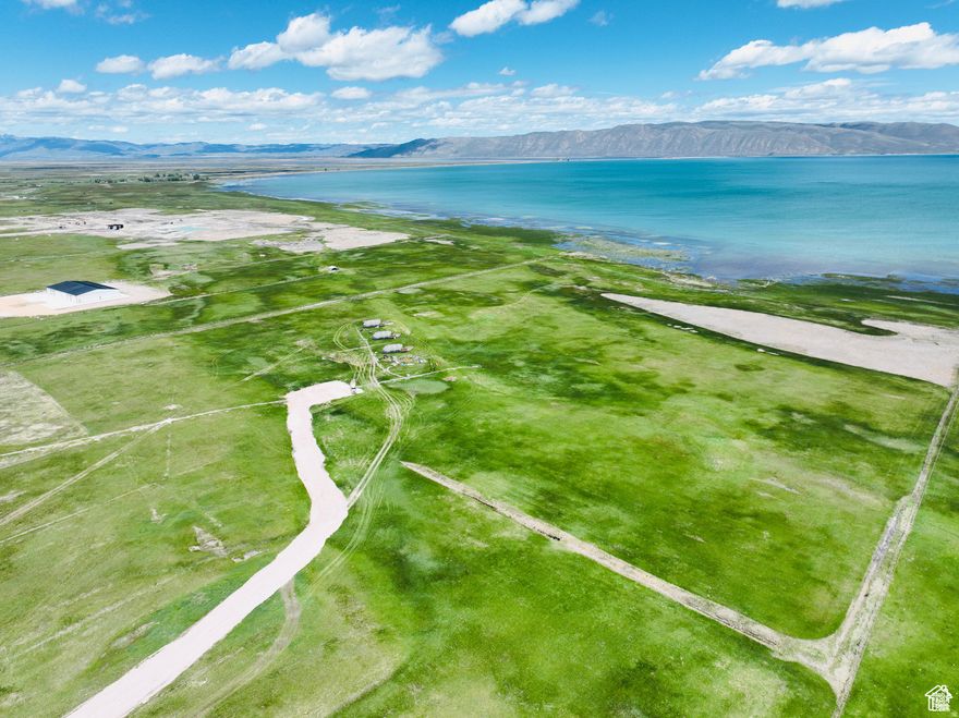 Prime Waterfront development land on the West shores of Bear Lake Idaho/Utah. 1,313 feet of waterfront access. Power has been ran to the middle of the property, a commercial well has been drilled, and a new access and 2,000 feet of road has been installed. Property consists of 2 different parcels being sold together. Access is off Highway 89 with prime exposure and development possibilities.