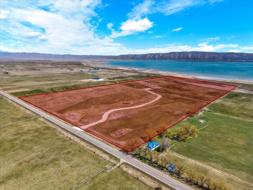 Prime Waterfront development land on the West shores of Bear Lake Idaho/Utah. 1,313 feet of waterfront access. Power has been ran to the middle of the property, a commercial well has been drilled, and a new access and 2,000 feet of road has been installed. Property consists of 2 different parcels being sold together. Access is off Highway 89 with prime exposure and development possibilities.
