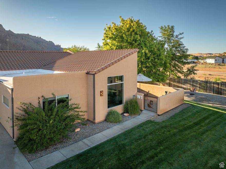 Stunning Rim Village Condo with Breathtaking Views. Discover the perfect blend of comfort and luxury in this beautifully updated condo located in Rim Village, just three miles south of downtown Moab. This property not only offers amazing vistas of the iconic Moab Rim and the majestic La Sal Mountain Range, but also features a modernized interior that was expertly renovated in 2024. Step inside to find fresh paint, durable LVP flooring, and tasteful new furniture throughout. The three inviting bedrooms are furnished with brand new king-size Purple mattresses, ensuring a restful night's sleep. Enjoy the convenience of new electric blinds, professionally sealed garage floors, and a utility sink with a hose bib. For your entertainment needs, new TVs are installed in the living room, primary bedroom, and garage.This flexible property is ideal for a variety of uses: whether you're looking for a full-time residence, a second home, or a lucrative nightly or executive rental, this condo has it all. Enhancing the ambiance is beautiful artwork, including locals Whit Richardson's captivating "Moon Over Windows" photo on canvas, adding a touch of elegance to the space.Don't miss this rare opportunity to own a piece of paradise in Moab, where adventure and relaxation await!