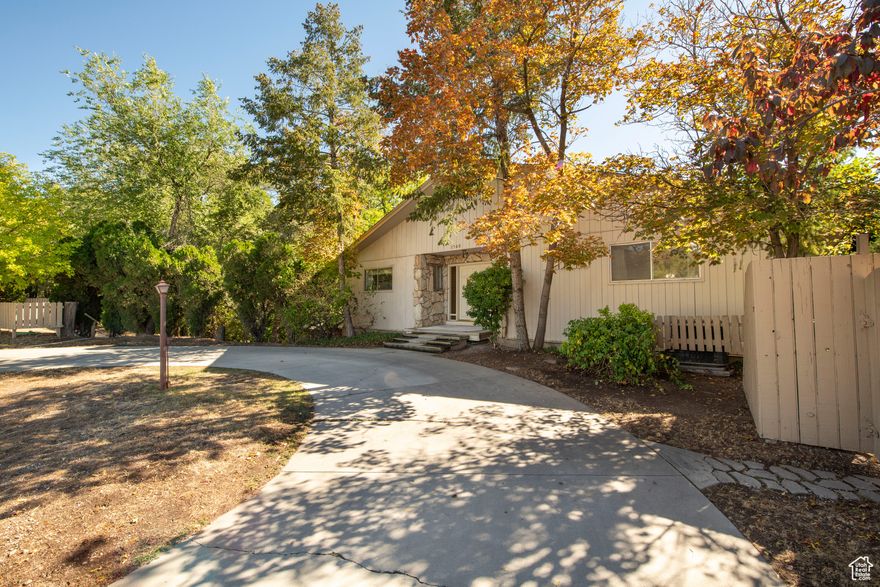 Unique Harvard/Yale opportunity: 6,000 sq ft home offering a rare combination of privacy and location. Incredible potential for a multi unit income producing investment property! Situated on one of the largest lots in the area, the home is surrounded by mature trees that provide seclusion and natural beauty. Multiple covered decks create an indoor-outdoor living space. Home was engineered for durability, featuring 12" steel-reinforced concrete foundation, overbuilt steel I-beams, and Boise-Cascade free-span attic trusses. The property features two non-conforming mother-in-law apartments, multiple off-street parking spaces, most of which are covered, and a private circular driveway that facilitates easy access to Sunnyside Avenue, even during peak traffic. The basement features two large shop areas with adjacent office/flex space. The sale includes shop machines, hand tools, and workbenches. Upgraded main electrical service, weatherhead, and exterior subpanel. Additional highlights include Red Butte Creek running through the property, cool mountain breezes from the adjacent gully, and proximity to Sunnyside Park, which offers basketball and tennis courts, baseball diamonds, playgrounds, and Gazebos with open-pit BBQ , all directly across the street. Prime location, just minutes from the University of Utah, Hospitals, Huntsman Cancer Institute, and Top-Rated Schools. Minutes from Downtown Salt Lake City, freeway access, year-round canyon recreation and world class skiing.