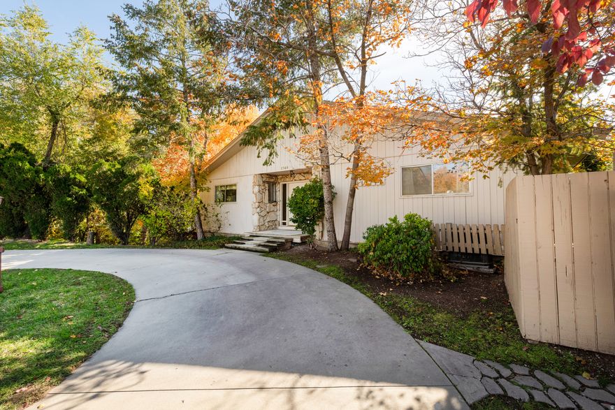 HUGE PRICE IMPROVEMENT!!! Unique Harvard/Yale opportunity: 6,000 sq ft home offering a rare combination of privacy and location. Solid, well-built, beautiful home with Red Butte Canyon creek flowing through the property. A secluded, wooded lot filled with mature trees fronting on a magnificent gully just minutes from downtown Salt Lake City. Incredible potential for a multi-unit income producing investment property! Situated on one of the largest lots in the area. Multiple covered decks create an indoor-outdoor living space. Home was engineered for durability, featuring 12" steel-reinforced concrete foundation, overbuilt steel I-beams, and Boise-Cascade free-span attic trusses. The property features two non-conforming mother-in-law apartments, numerous off-street parking spaces, most of which are covered, and a private circular driveway that facilitates easy access to Sunnyside Avenue, even during peak traffic. The basement features two large shop areas with adjacent office/flex space. The sale includes shop machines, hand tools, and workbenches. Upgraded main electrical service, weatherhead, and exterior subpanel. Additional highlights include cool mountain breezes from the adjacent gully and proximity to Sunnyside Park, which offers basketball and tennis courts, baseball diamonds, playgrounds, and Gazebos with open-pit BBQ, all directly across the street. Prime location, just minutes from the University of Utah, Hospitals, Salt Lake City Sports Complex (an indoor/outdoor swimming pool, fitness center with weights and cardio equipment, and yoga and aerobics classes), Huntsman Cancer Institute, and Top-Rated Schools. Close to freeway access, year-round canyon recreation with world class skiing.