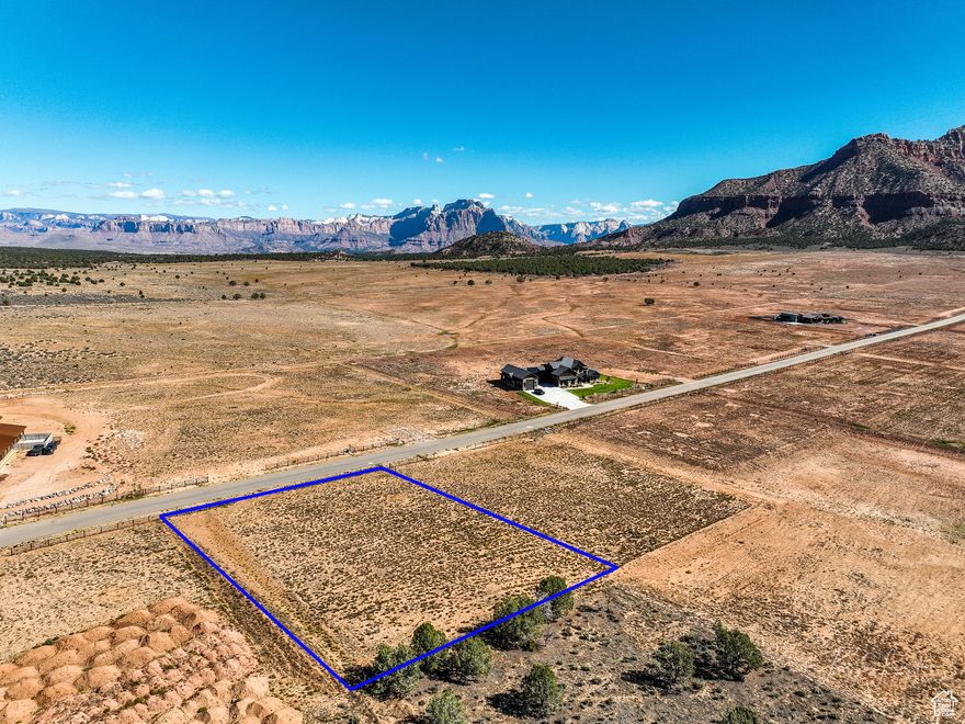 Discover 1.98 acres in the prestigious Wells Estates of Apple Valley, offering panoramic views of Zion National Park and striking red rock vistas. With paved roads, excellent access, and ample space for your custom estate, this property is the perfect canvas to create the dream home and lifestyle you've envisioned.