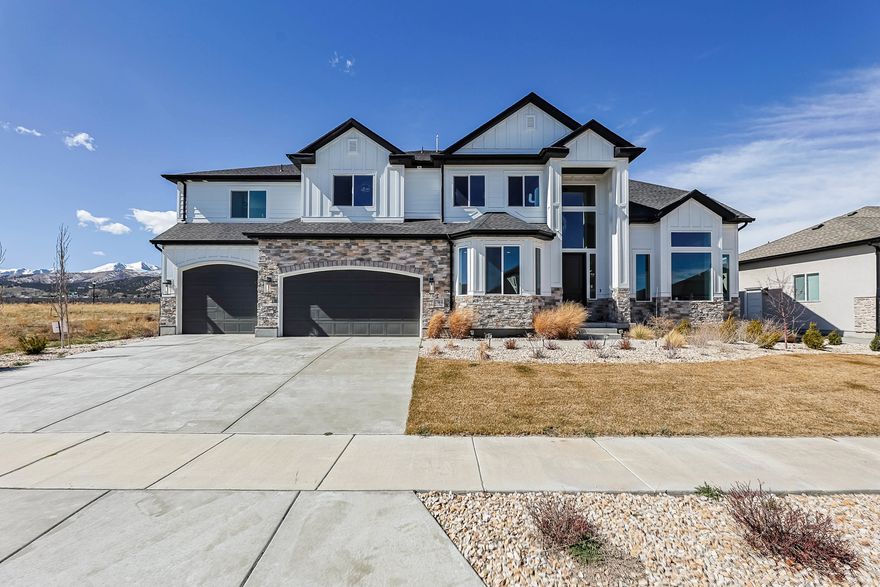 Beautiful home with open-concept layout and high ceiling.  It's only two years old in pristine condition.  The stone and cement board exterior give a modern and well-crafted look that stands out from the rest.  It's one of the largest floor plan in the neighborhood with each room have private access to its bathroom.    The main floor has a formal living and and a formal dining room in additional to a family room.  The chandeliers upgrade worth more than ten thousands with vaulted ceiling and big wide windows, give the house a sophisticated glow.  The 3-car garage has a tandem and high ceiling that allows for plenty of storage space.  Come see it today!!!