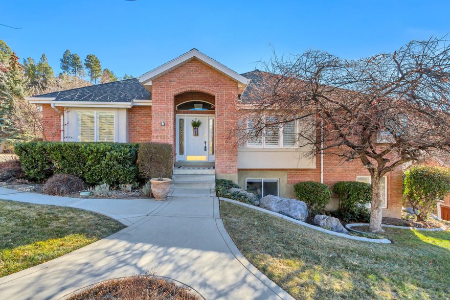 Welcome to this beautifully maintained rambler in the highly sought-after Rock Canyon Estates community. Offering 3 bedrooms and 3 bathrooms across 3,957 sq. ft., this pristinely kept home features numerous thoughtful updates throughout. The inviting open floor plan is perfect for entertaining, highlighted by a formal dining room and spacious living areas filled with natural light. The huge main-level master suite creates a perfect retreat for relaxation. Downstairs, you'll find a fully functional ADU apartment with a private walkout entrance, 2 bedrooms, and 1 bathroom-an excellent income opportunity to help offset your mortgage or accommodate multi-generational living. Enjoy the convenience of being within walking distance to Rock Canyon Park and nearby trailheads, while also being just minutes from the brand-new Provo Temple. Located in a desirable low-maintenance community, this home combines comfort, flexibility, and location. Don't miss your chance to own this exceptional property in one of Provo's most coveted neighborhoods!