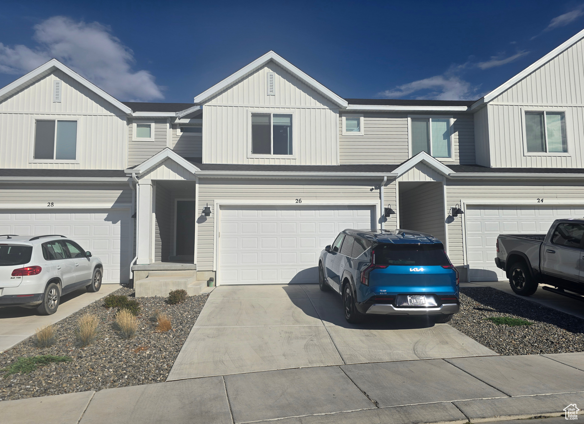 LIKE NEW! Enjoy this cute town home with large open kitchen/family area, enclosed patio, large bedrooms with primary suite and his & hers closets. EV charger included and ready to use! Includes kitchen fridge, water softener, water filtration system, and more!!