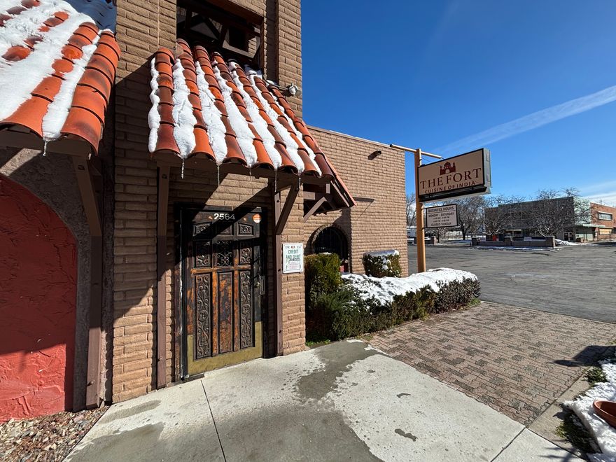 Prime creative redevelopment opportunity in Ogden's Nine Rails Creative District (C-9 zoning) with high-visibility frontage along Ogden Ave, situated on over 0.5 acres of land-a rare footprint for a downtown creative district site. Located at 2564 Ogden Ave, this downtown commercial property is positioned for adaptive reuse or repositioning into arts-forward commercial concepts, including studio, fabrication, gallery-retail, experiential retail, or creative community space, consistent with Ogden City's vision for the district. The property is currently licensed as a restaurant and The Fort Indian Restaurant is currently operating on-site, providing existing commercial infrastructure that can support a range of permitted or conditional uses under OMC 15-34-2 (C-9 zone column), with additional use standards per OMC 15-34-3 and downtown parking requirements based on proposed use per OMC 15-12-3.