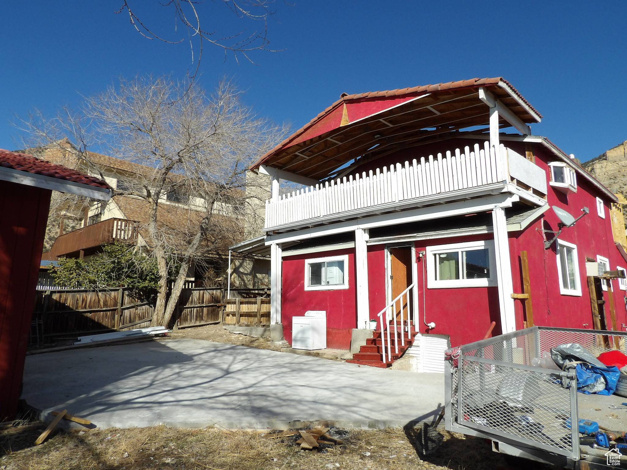 If you are looking to get out of the city and enjoy the country, then this is the place for you! Spanish style two story stucco home located in Kenilworth, Utah. There's an addition currently being built on the 2nd story that could be used as a study, sitting area, reading nook or just an area to relax. One bedroom and full bathroom located on the main level. Kitchen and dining area have light colored tile flooring. Large family room and a den/office or possible 2nd bedroom on main level along with a laundry room. Unique wood stairway leads upstairs to the two large rooms that could be used as bedrooms. There is a 3/4 bathroom on the 2nd story with tile flooring. Step outside onto the deck on the 2nd story and enjoy the beautiful views of the mountains. There is a detached 2-car garage with cement flooring with a woodstove, workbench and workshop area. Also, includes a patio outback for BBQ's, picnics, a wooden privacy fence and a built-in hammock. Take the time to enjoy the gorgeous views and quietness of Kenilworth. Watch the deer walk through the yard along with other wildlife that may be seen throughout the day. Plenty of parking out back by the garage area and there is parking under the carport. Lots of storage in the basement and garage. Square footage figures are provided as a courtesy estimate only and were obtained from Carbon County Records.  Buyer is advised to obtain an independent measurement.