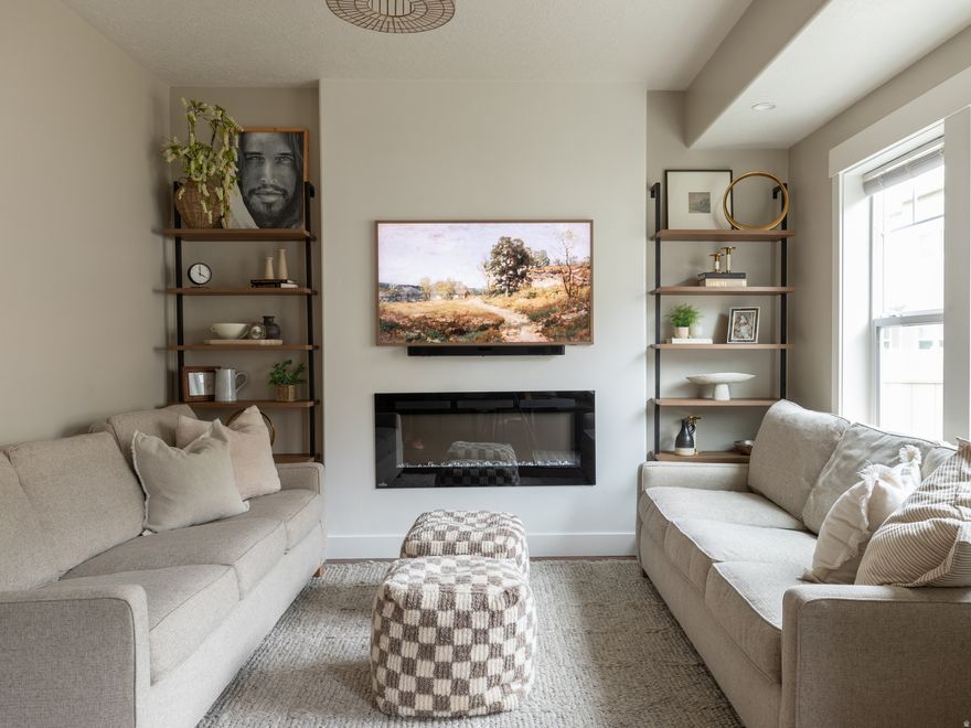 Elegant and modern townhome living with a 2-car garage and a thoughtfully refined interior. Granite countertops, rich cabinetry, vaulted ceilings, and a cozy fireplace create a polished, upscale atmosphere. Unwind in the spacious primary suite and enjoy a prime American Fork location near shopping, dining, and commuter routes. Call now for a private showing.