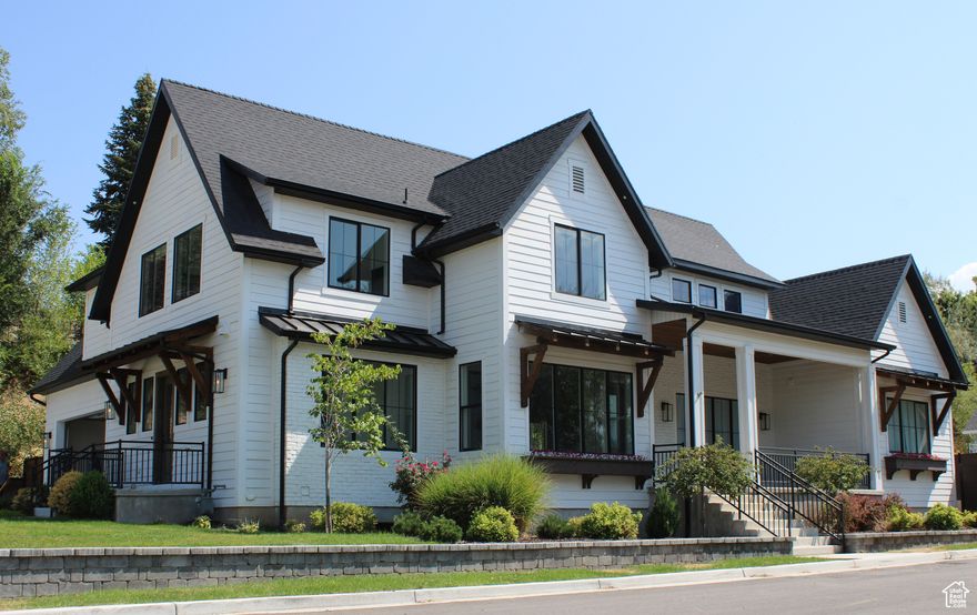Beautiful newer home on a large lot with numerous custom features. The home is directly across the street from the Spring Acres Arts Park and within close walking distance to Springville High School. The kitchen, living, and dining area work together in an open layout for a big, beautiful gathering area. The home also features a three bedroom, two bathroom basement apartment with a master bedroom and a similarly open and spacious layout. Here are a few other features of the home: large basketball court; in-ground trampoline; bordered by a hill on one side and a year-round brook on the other, with an extra tall privacy fence in the back; garden area; large outdoor patios; custom fireplace; custom, built-in shelves; auxiliary food prep area off the main kitchen;  high-end CAF appliances (fridge, stove, dishwasher); office area with custom shelving; vaulted wood-plank ceilings; main floor living with a master bedroom, kitchen, etc. on the main floor. There is a fenced, off-street parking area, and the Seller, who is a licensed contractor, is willing to build at cost an additional parking garage in that area at buyer's request.    Square footage figures are provided as a courtesy estimate only.  Buyer is advised to obtain an independent measurement.