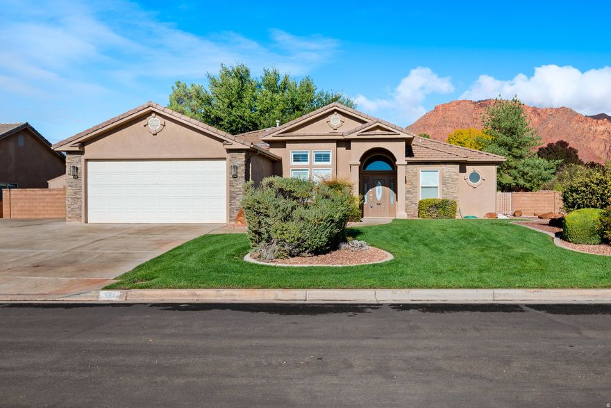 Corner lot with clear views to Red Mountain, this single-level home keeps everyday living simple and comfortable. Extra parking adjacent to the garage is ideal for an RV, or desert toys. Plus a spacious yard that's both usable and low-maintenance.