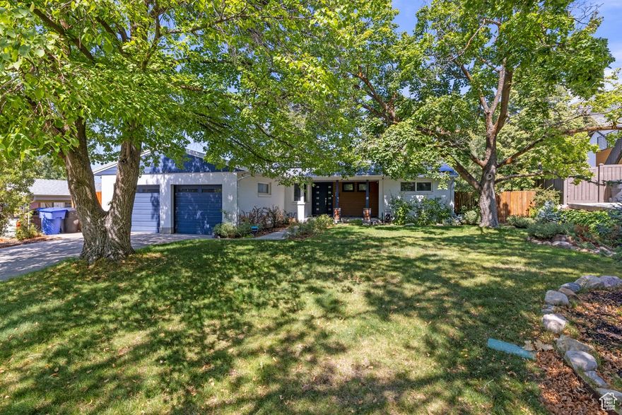 Stunning Olympus Cove Gem on Expansive Lot with Incredible Views! Situated on a generous, private lot in one of Salt Lake's most desirable neighborhoods, this beautifully updated home offers sweeping mountain and valley views. The fully fenced yard provides both privacy and space for play, while the oversized two-car garage is perfect for storing all your Utah adventure gear. Inside, you'll find rich hardwood floors, a tastefully remodeled kitchen with a gas-range and oven, updated bathrooms, and abundant natural light throughout. On the main floor, walk out to the backyard with an expansive private deck that is perfect for entertaining and family get-togethers. The large backyard featuring a hot tub also makes for effortless relaxing and entertaining. Two cozy fireplaces add warmth and charm in those winter months. The primary suite has a separate spa-tub and shower to handle those busy mornings, and the recently remodeled full-daylight basement features newly insulated walls and sheetrock, new paint, lighting, and carpet. Major updates also include a high-efficiency dual-fuel heat pump, water heater, and roof. Plus, the fully paid-off 6.1KW solar system adds great efficiency and value. This rare find offers comfort, style, and an unbeatable location-don't miss your chance to make it yours!