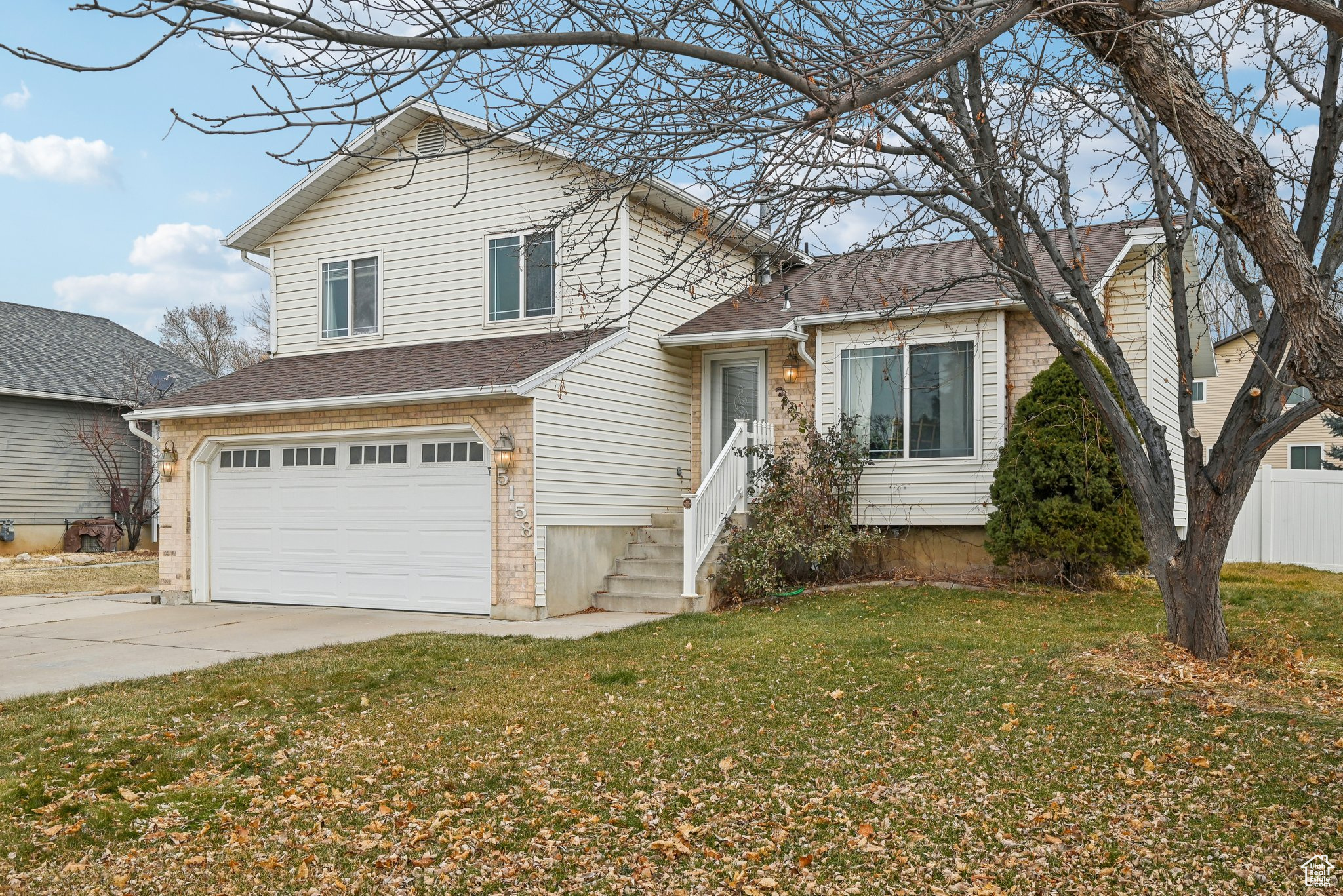 This is a charming 1,888 sqft tri-level home, perfectly located near the Roy Aquatic Center and Eagle Lake Golf Course! The thoughtfully designed layout features three bedrooms upstairs, including a spacious primary bedroom with an ensuite bathroom, and two additional bedrooms and guest bathroom. On the main level, you'll find a welcoming room as you enter with vaulted ceilings, along with a kitchen and dining area. Just a few steps down, a large family room with a cozy fireplace awaits.  The lower level offers a fourth bedroom, a half bathroom that has has the space to add a shower, and a convenient laundry room.