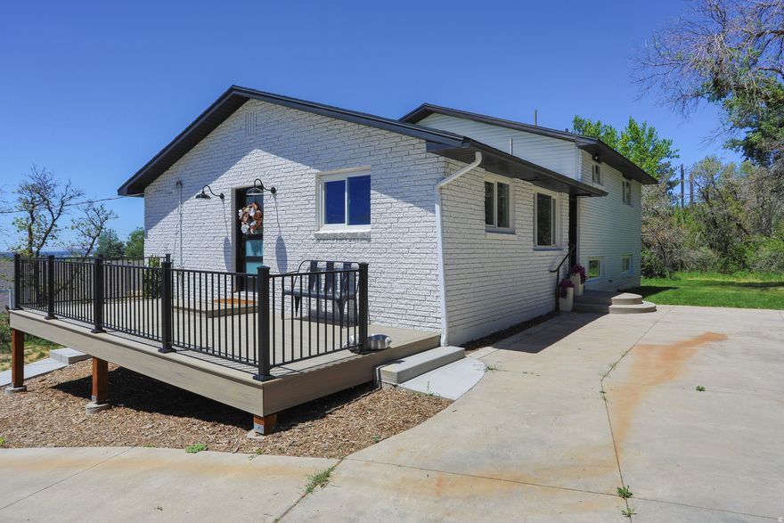 Mid-century remodel with modern clean lines, a large lot, and a huge 4-car garage. Tucked into a forested lot in the foothills of Fruit Heights. Enjoy serenity and views! Besides the solid bones of this home, everything is brand new: Roof, windows, plumbing, electrical, fixtures, kitchen appliances (36" wide range!), HVAC, sprinklers, sod, quality flooring-- Tile and carpet throughout. Enjoy the rare trifecta of: 1) wooded PRIVACY in the yard (East Side for shaded Summer BBQs) 2) A view of the MOUNTAINS from a large front deck, 3) a view of the VALLEY from the large front deck. Enjoy perhaps the most solid 4 car garage (with Shop area) ever built-- highway Bridge trusses as the roof-- Could accommodate a large ADU on top of this garage. This home is literally next door to the Bonneville Shoreline Trail for world class Mountain biking and hiking. SLC is a short 20 min commute, 25 min to Snowbasin, 12 min to Ogden, >10 min to two malls, grocery, dining, gyms.