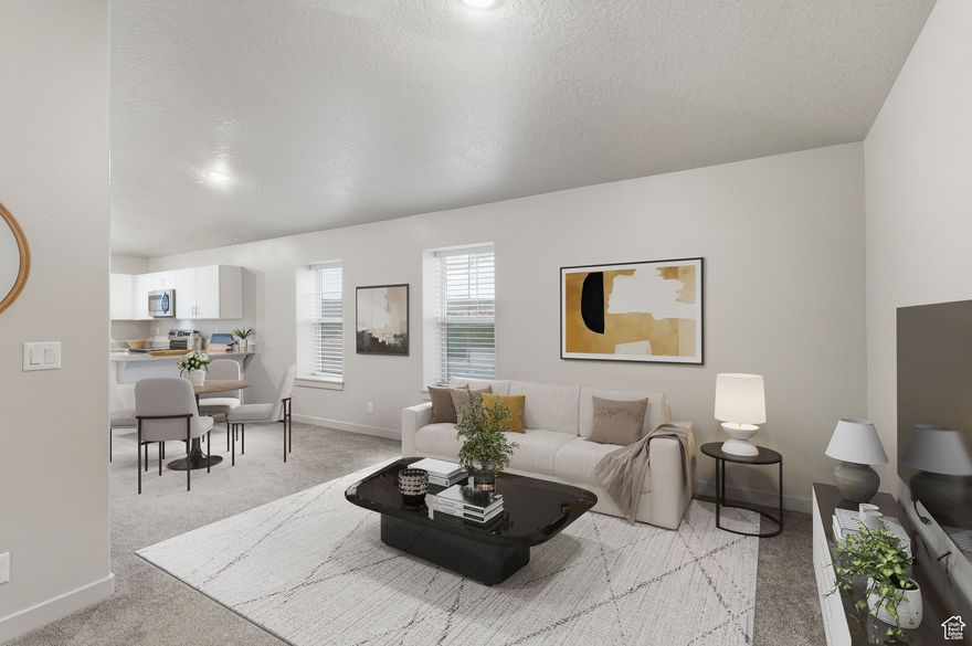 Brand New Feel Immaculate 3rd Floor END UNIT Condo! This stunning third-floor end unit condo feels like new construction and has been barely lived in! It is located in a prime Washington City location, it offers easy access to I-15, city amenities, and is close to a community park and the community pickleball courts. Don't forget to enjoy the vaulted ceilings and extra windows in this third floor unit that provide SO much natural light. The windows and vaulted ceilings create an open, airy feel, and the tinted windows throughout the home help keep it cool and energy-efficient. The condo also includes covered parking for your convenience. It has  modern finishes and a well-maintained interior, this home is truly move-in ready. Don't miss this exceptional opportunity to own a low-maintenance home in one of Washington's most desirable areas!