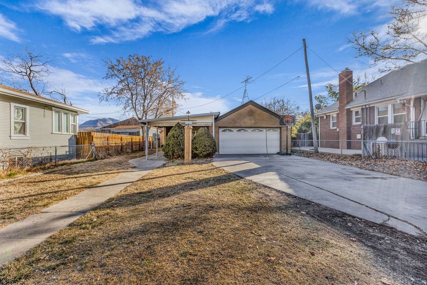 This rambler offers a surprisingly open layout with great flow, featuring a generous front living room, a large dedicated dining area, and a bright kitchen with plenty of cabinet space. Classic built-ins, storage throughout, and two fireplaces - one on each level - add character and flexibility. There's also room for an in-home office or creative workspace, making the floor plan even more functional.   Outside, enjoy an attached 2-car garage, a sizable shed and a large covered patio, an enclosed front yard, and extensive off-street parking with space for multiple vehicles, trailers, or projects.  With its central location and a layout that offers both openness and opportunity, this home provides a solid foundation for someone wanting space inside and out.