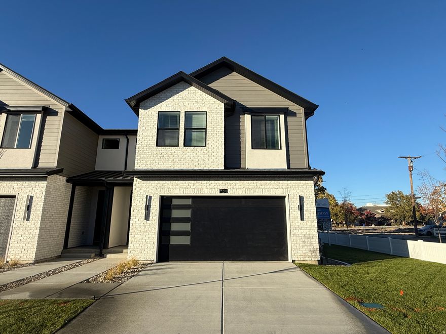 MOVE-IN READY! Beautiful new Twinhome in Trailside Reserve featuring the Brighton Modern design package with sleek cabinetry, quartz countertops, matte black hardware, modern tile selections, and LVP flooring throughout. EV-ready 2-car garage and fully fenced yard. Includes under-cabinet lighting and a fireplace. Conveniently located minutes from shopping, dining, and freeway access. Excellent builder incentives available. Visit our model home at 6760 S 300 E, Midvale, UT. Open MondaySaturday, 12 PM6 PM. Photos may vary by unit.