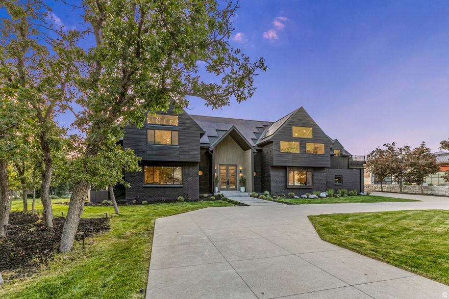 Nestled within the prestigious 24-hour guard-gated Pepperwood community, this completely remodeled luxury estate offers an extraordinary blend of scale, design, and lifestyle. Spanning 10,741 sq ft, this exceptional residence features an impressive 8-car garage, 3 kitchens, a private basement apartment, and beautifully designed spaces ideal for both everyday living and grand entertaining. The expansive primary suite is a true retreat, complete with a sitting area, massive walk-in closet, spa-inspired bath, and 2 private decks. Nearly every bedroom offers its own en-suite bath & walk in closet, providing exceptional comfort and privacy. Enjoy movie nights in the theater/media room, multiple gathering spaces, and seamless indoor-outdoor living with five incredible outdoor entertaining areas, including a spectacular rooftop deck featuring multiple sitting areas and breathtaking Wasatch Mountain views, plus two expansive patios below. Located in coveted Pepperwood, residents enjoy resort-style amenities including a pool, spa, splash pad, tennis, pickleball and basketball courts, walking trails, playgrounds, and year-round community events all just minutes from world class skiing, hiking, shopping, and dining.