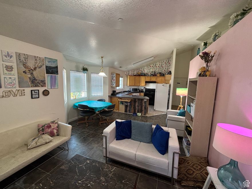Experience elevated living in this modern 3-bed, 2-bath Harvest Hills condo featuring breathtaking views of Utah Lake and the mountains. Enjoy a bright, open layout with no upstairs neighbors, a private garage plus reserved parking, and included appliances (fridge, washer, dryer). Community offers pool, gym, and beautifully maintained grounds. Close to Saratoga Springs amenities with easy access to Lehi and I-15- the perfect blend of comfort, style, and location.