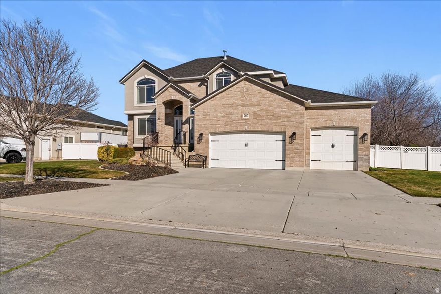 WELCOME HOME to this inviting Syracuse two-story nestled on a nearly half-acre lot with unbelievable resort-style landscaping, located just minutes from West Davis Corridor access.  Enjoy a spacious, easy-to-live-in floor plan featuring a fully finished basement, three separate living areas, five large bedrooms, and a formal living room. The thoughtfully designed laundry room with built-in lockers provides excellent storage and everyday convenience.  Inside, updated corianders countertops, paint, carpet, and refinished custom cabinetry create a warm, updated feel throughout the home.  But the real magic happens outside. Step into your private, park-like backyard featuring a massive patio and a crystal-clear saltwater pool - perfect for entertaining and relaxing all summer long. This backyard will quickly become the go-to gathering spot for friends and family.  The oversized three-car garage includes a convenient  bath, ideal for pool guests in the summer and perfect for projects or hobbies during the winter months.  Opportunities like this rarely come available in Syracuse-where a beautifully updated home, nearly half-acre lot, and private backyard resort all come together. Schedule your private showing today and see why this will be the home everyone is talking about.