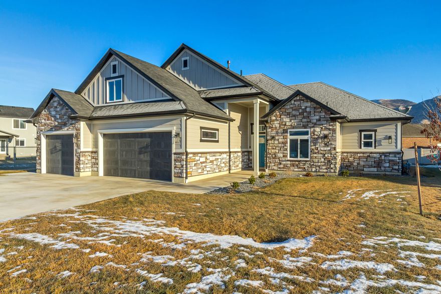 Experience the perfect blend of modern luxury and effortless living in this stunning, like-new construction patio home with a huge bonus room. This pristine home offers single-level living without compromising on space or style.  The huge, fully finished bonus/family room has its own mini-split HVAC system for added comfort.  The great room immediately impresses with its vaulted ceilings and abundant natural light.  At the center of it all is a spacious kitchen featuring quartz countertops, a large island with seating, and stainless steel appliances.  The custom cabinetry has a hidden (butler) pantry that provides incredible storage and convenience right at your fingertips.   The primary bathroom features an en-suite bath. Step outside to the covered patio with mountain views and a professionally landscaped yard with a fire pit.  Located in a fantastic neighborhood with no HOA dues. The washer & dryer are included. The remaining furniture is available.  Utopia fiber internet and Dish TV are available. Secondary water is Morgan Secondary Water.