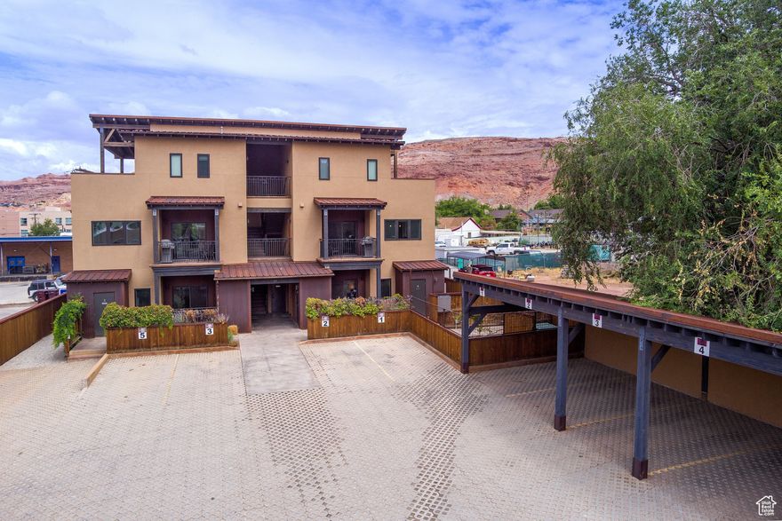Discover 57 Robbers Roost, Unit #1-a 1,095 sq. ft., 2-bedroom, 2-bath condo in the heart of downtown Moab. This spacious unit is fully turn-key, featuring a full kitchen, washer and dryer, central air, fiber internet, bike storage, BBQ grill, and both covered and uncovered parking. Owners and guests can enjoy shared amenities, including a bike repair station, making it the perfect base for red rock adventures. When you're in Moab, it feels like home; when you're away, offset expenses with the opportunity for short-term rentals. Just steps from local restaurants, shops, bars, and year-round events, this property offers the best of convenience and comfort.