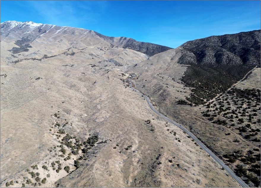 515 scenic acres between Rush Valley & Terra, Tooele County, Utah. Beautiful views, rolling hills, mountain topography, natural springs, two separate gated access points to useable land on both sides of SR199. 515.07 acres zoned MU-40 (Multiple Use 40-acre min lot size).  0.72 acres of useable land zoned CH (Commercial Highway). Patch Springs fire (2013) destroyed previous use - Willow Springs Lodge restaurant, bar, trailer park, cabin (no foundation), and gas station. Infrastructure/Utilities: Power, Septic (3), Propane, & Private water. Water Right #16-565 placed in non-use until 10/31/2027 - Water Right could be pulled out of non-use by Buyer for up to 15 acres of irrigation, 12 ELUs for stockwatering, or 2.2 EDUs for a domestic use. Historically used for the grazing of cattle (Greenbelt taxes: $809.84) 23 miles southwest of Tooele, 55 miles southwest of SLC, UT.
