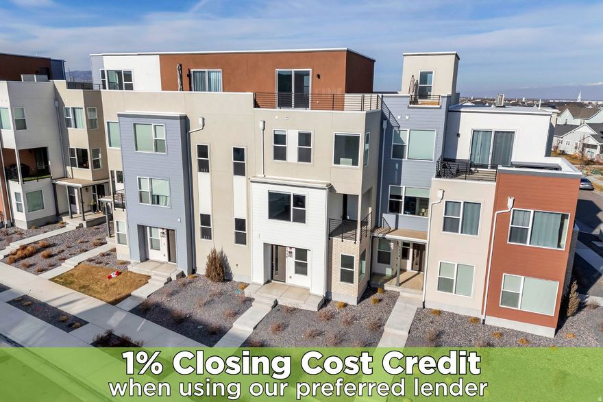 Stunning 4-story townhouse in the heart of Daybreak, designed to impress from every level. Enjoy seamless indoor-outdoor living with a living room balcony and an expansive rooftop terrace, perfect for entertaining or taking in sweeping views of the south end of the valley. Sunlight pours through large, south-facing windows that wrap the home, creating bright, airy spaces throughout.  The kitchen is light and inviting, featuring stainless steel appliances and a clean, modern feel. Retreat to the spacious, light-filled primary suite, complete with a spa-inspired primary bath showcasing a walk-in shower with seating bench and sleek black hardware. Additional highlights include an attached 2-car garage and thoughtful design details that blend style, comfort, and functionality.  Ideally located near the TRAX station, the new Bees stadium, and Ewok Park, this home offers unbeatable access to recreation, entertainment, and easy commuting, all while enjoying elevated living in one of Daybreak's most desirable settings.