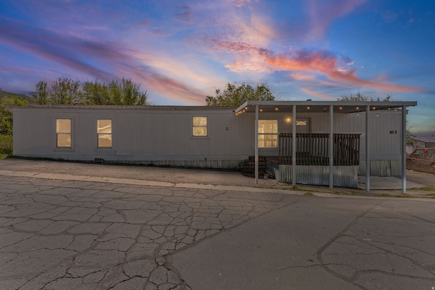 Clean, updated, and move-in ready-this home is a must-see! Featuring 2 bedrooms and 2 bathrooms, this well-maintained manufactured home offers modern comfort with new appliances, including a range and refrigerator, along with new windows and central A/C. Enjoy durable laminate and tile flooring, a covered front porch, and a newly built back porch where you can take in beautiful lake views and unforgettable sunsets. Tucked at the end of a quiet cul-de-sac, this home also includes two storage sheds and steel skirting for added value. Sale includes the manufactured home only (lot not included). Community features include culinary well water, irrigation water, and road snow removal. Conveniently located near Hwy 89 and I-15 for easy access. Nature lovers will appreciate the nearby elk farm-enjoy peaceful evenings listening to elk bugling in the distance. Square footage figures are provided as a courtesy estimate only and were obtained from a prior listing. Buyer is advised to obtain an independent measurement.