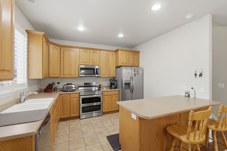 Great townhome located on the Herriman/Riverton border! This well-maintained home features 3 bedrooms and 2.5 bathrooms, along with a large 2-car garage and a 2-car driveway for plenty of parking. The property backs directly to a park, offering extra privacy and open space. Inside, you'll find brand new carpet and new stainless steel appliances, all included. The water heater was replaced in 2020 for added peace of mind. The spacious primary bedroom features a walk-in closet, providing plenty of storage.