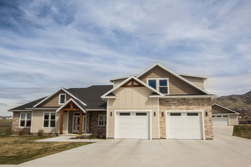 `SPECTACULAR HYDE PARK home built for main floor living and family gatherings.  Built with exceptional quality and detail by the contractor for his family.  SPACIOUS GREAT ROOM with hardwood flooring, 9' ceilings, living room or office with built-in cabinets & bookcase, rock fireplace, main floor laundry with cabinets & sink, custom kitchen cabinetry, large center island with sink, incredible walk-in pantry, second main floor family room that could be modified for a 4th and 5th BEDROOMS, MAIN FLOOR MASTER BEDROOM with spacious double sink bathroom, walk-in closet, & two head shower. You will love the upstairs family room, additional bedroom and bathroom.  This home also has a beautiful 0.51 acre yard with garden area, covered patio with cedar wood ceiling, 30' x 38' (980 sq ft) HEATED SHOP, flat driveway for RV parking that is large enough for a basketball & pickleball court.  This home also has an RV dump & hookups, generator hookup panel, instant hot water, laundry chute, fruit trees, garden shed area and so much more!