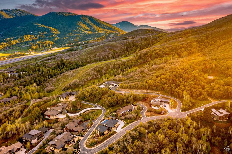 READY TO BUILD WITH PLANS on the lowest-priced gated community lot in the Park City school district.    This .6-acre estate lot in The Woods of Parleys offers a rare opportunity to create your mountain retreat in one of the area's most exclusive gated enclaves.    Set at the end of a quiet road, the property combines unmatched privacy with panoramic views of Park City's Murdoch Peak. The 192-acre community is a sanctuary of forest, wildlife, and 4.5 miles of private walking and biking trails-yet it's only minutes from both Park City and Salt Lake City.    All utilities are already on-site, and custom home plans are prepared and ready for submission to the HOA. The groundwork is in place to bring your vision to life with ease.    This property delivers elegance, seclusion, and convenience in one-and at a price point that makes it a standout opportunity in the Park City market.