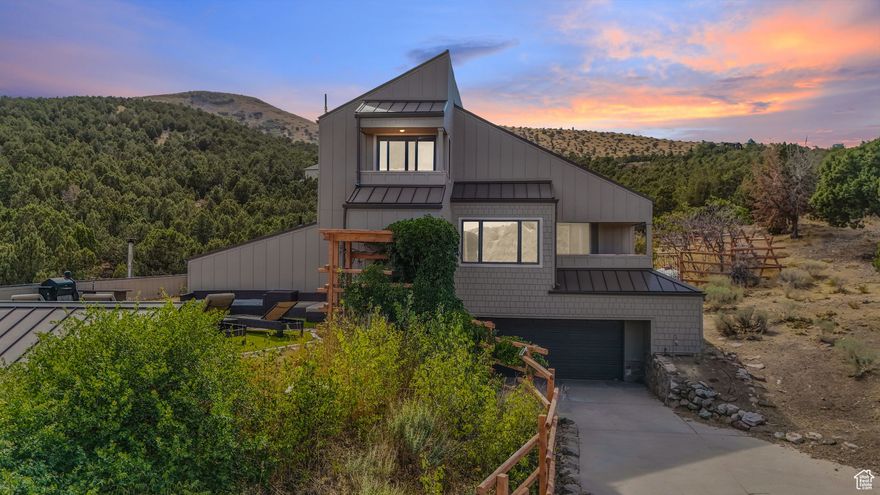 Experience unmatched mountain living.  This remarkable home boasts sweeping panoramic views of the Salt Lake Valley and surrounding peaks, with direct access to some of Utah's finest outdoor recreation. Step outside to enjoy hiking, biking, and equestrian trails right at your doorstep-all just minutes from shopping, dining, and entertainment at Mountain View Village. Inside, expansive windows flood the home with natural light, framing the breathtaking scenery and creating a warm, inviting atmosphere. Designed for both comfort and style, the property offers the perfect balance of privacy and convenience. Tucked away in a serene setting, it's still only a short drive to Bangerter Highway and I-15, ensuring an easy commute. Whether you're savoring sunsets from your deck, exploring nearby parks, or simply enjoying the peaceful surroundings, this home is a rare gem that captures the very best of Herriman living.