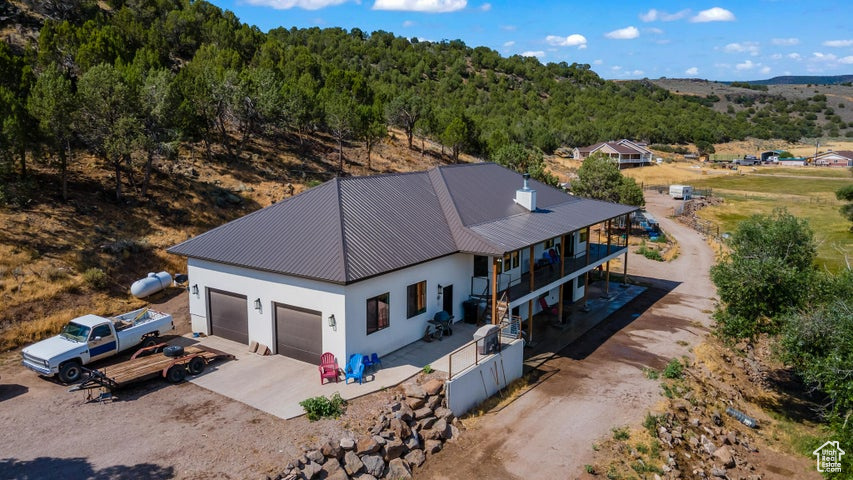 Beautiful mountainside mini ranch home on 10 acres. Enterprise, UT is a small rural farming town in Southern Utah. Only 40 minutes from St. George or Cedar City. Built in 2020 with 3,603sqft, 5 beds, 2.5 bath, large oversized 979 sqft 2 car garage, on 10.55 acres. Walkout basement. Open Floor Plan. Living room on main and family room in basement. Fireplace. Plenty of room for horses, animals, build a shop, barn, or stable. Enjoy coffee or cocoa on the deck. Nestled against the mountainside for privacy and with beautiful views all around. South property line backs to BLM land. Enterprise Reservoir is only 15 minutes away for fishing and boating. Lots of outdoor recreation. Close to restaurants, grocery, schools, medical, auto services, and hardware. Rural life with convenience. A must see.