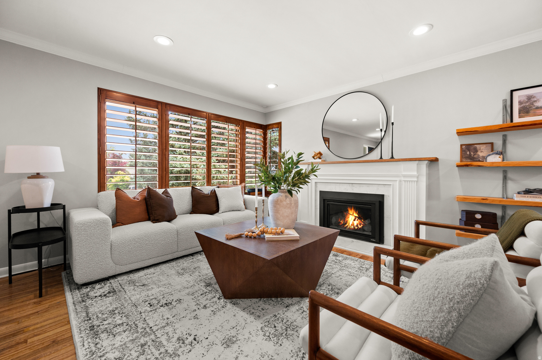 Living area featuring wood-finish flooring and a decorative area rug