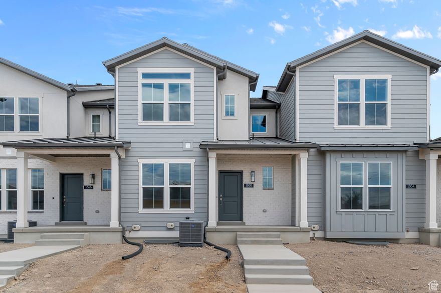 Step into comfort and style with this thoughtfully designed Vancouver Town Home!  Designed with modern convenience in mind, the home includes a tankless water heater and timeless Craftsman base & casing accents. The owner's bathroom is a relaxing retreat with cultured marble shower surrounds and satin & brushed nickel hardware for a clean, contemporary finish. Also featured you will find a modern kitchen with white laminate cabinets, sleek quartz countertops, and stainless steel gas appliances. Enjoy a blend of durability and warmth with laminate hardwood, vinyl tile, and carpet flooring throughout. Comes fully landscaped and maintained by the HOA for hassle free living, come enjoy this comfortable, energy-efficient townhome in a great community!