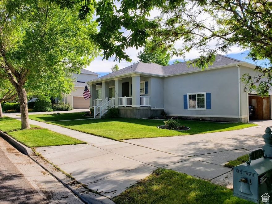 Nestled in a charming neighborhood filled with mature trees and wide, quiet streets, this property offers a rare opportunity to own a spacious lot with endless possibilities. The home sits on a generous yard that's perfect for gardening, entertaining, or simply enjoying the outdoors. A standout feature is the large detached shop-ideal for car enthusiasts, hobbyists, or extra storage-with space for up to three vehicles.  Inside, the home offers comfortable living spaces with charming character throughout. Whether you're looking to settle in as-is or renovate and put your own stamp on it, this is a home you can truly make your own-set in a location you'll love for years to come.  *The high school will be changing to Deseret Peak High in the 2025/2026 School year. All appliances in the home are included. The furnace and A/C are new, and the roof is only 1.5 years old. Motivated Seller!