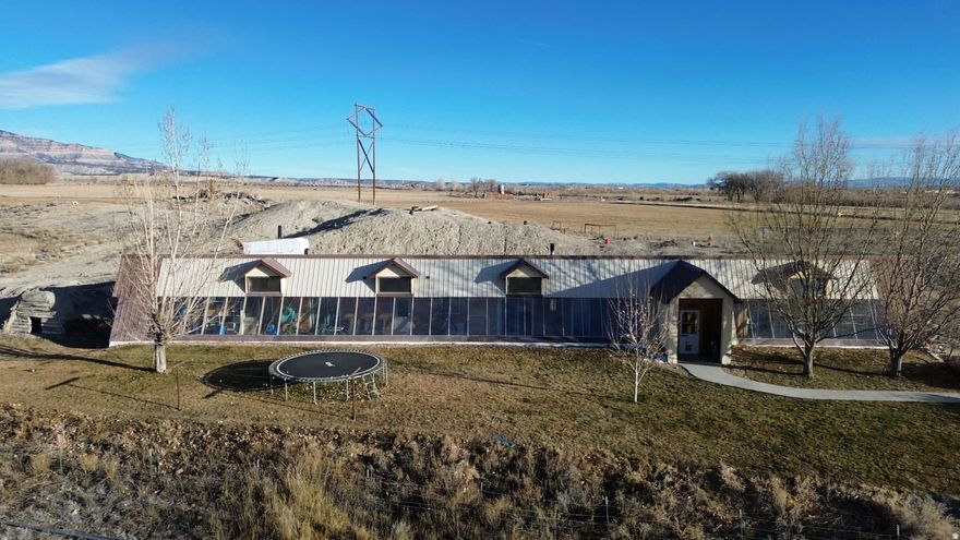 This incredible income-producing agricultural property is thoughtfully designed for self-sufficiency, comfort, and productivity. North West Field: Parcel #: 03-0046-0028 Acres: 23.630 2024 taxes -$70.01Grass Alfalfa Mix, Good stand. We planted grass this spring with established alfalfa grass. Has a tire stock water trough in the North West corner of the field. The property has 1 wheel line and 1 short-hand line. Irrigation lines were installed about 2014. East Field: Parcel # 03-0045-0015 Acres: 40.770 2024 taxes - $91.99 New Alfalfa planted in the fall of 2024, excellent stand, really thick .Has a stock water line but no trough. The property has 2 wheel lines which were installed in 2013 Home fields are divided into 3: Parcel #: 03-0046-0032 Acres: 25.910 2024 taxes - $86.64 Every feature has been carefully maintained and upgraded to maximize function and long-term value. Dishwasher (new September 2025) Water heater (less than 1 year old)Cold Storage: Approx. 160 sq. ft. Septic System: Pumped and serviced September 2025. Energy Efficiency: Additional attic insulation and upgraded roof screws with roof-cap venting completed winter 2024. Garden & Orchard: -acre fenced garden area featuring mature fruit trees  2 apple, 2 peach, 1 pear, 1 apricot, and 1 pie cherry  plus thriving blackberry, raspberry, and elderberry bushes. Deer have recently discovered the garden, so a deer fence is recommended to protect future harvests. Greenhouse: Cultivated for melons, peppers, culinary herbs, kale, medicinal herbs, and succulents. Sauna: Custom-built wet/dry sauna with natural rock seating and flooring  a unique, relaxing retreat (minor upkeep required to maintain roof soil cover). Accessory Dwelling Unit (ADU) Studio Apartment: 384 sq. ft. with a galley kitchen (refrigerator & electric stove), one bathroom, and washer/dryer hookups. Heated and cooled by a ductless heat pump installed 2015  perfect for guests, extended family, or rental income. Insulated Cold Storage: 8  8 (64 sq. ft.) refrigerated space built into the end of a 40-foot shipping container. Cooled with a Cool-Bot and A/C unit  ideal for produce or meat storage. Year Built 2008. Agricultural & Utility Buildings Dairy Barn with Apartment: 54  16 (864 sq. ft. total; 384 sq. ft. apartment). 8-ft ceilings in the milking area and sink room; 11-ft ceilings in the apartment. Tile floors with drains throughout. Separate septic system (emptied Sept 2025). Large Hay/Grain/Mechanic Pipe Barn: 144  63 (9,072 sq. ft.)  half cement floor, built 2025. Ceiling height 15 ft on the cement side and 20 ft on the hay-storage side. Metal Insulated Shop (north side of large barn): 28  26 (approx. 728 sq. ft.)  half workshop, half storage with built-in shelving. 11-ft ceilings. Year Built 2008. Equipped with 220 & 110 power and culinary water. Dog Kennels: 6 total  4 small and 2 large, great for dogs or small animals. Chicken Coop with Run: Yes  ready for fresh eggs daily! Water Rights: 144 B shares + 90 A shares  Huntington Cleveland Irrigation. Secondary Water Lines: Located at dog kennels (east side), corral pen, east of large barn, frost-free troughs in corrals and fields behind house. Sprinkler System: Secondary water supplies the garden and home lawn. Culinary Water: Available inside the dairy barn, apartment, insulated shop, and frost-free spigot in front of the home. The indoor grow box also uses culinary water. Water Line Maps: Detailed property maps show all line locations for easy maintenance. Square footage figures are provided as a courtesy estimate only and were obtained from Emery County. Buyer is advised to obtain an independent measurements Agents: please see attached documents.