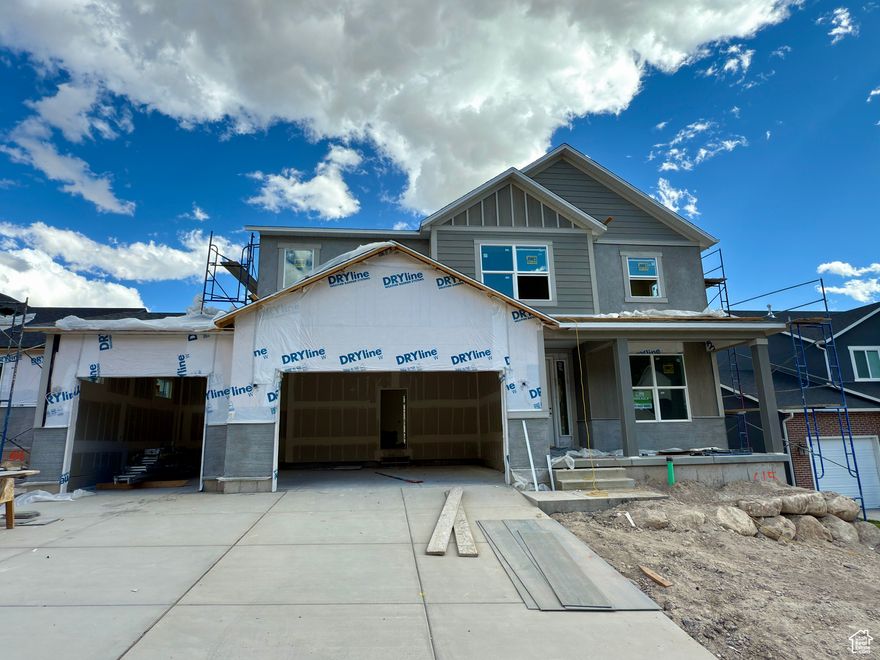 Stunning Walkout Basement Home with Incredible Views! No HOA! Welcome to East Eagle Mountain, a scenic gem tucked in the Kiowa Valley of Lake Mountain. This beautiful new construction home offers the best of Utah living-just minutes from Eagle Mountain Bike Park, hiking trails, and local shopping-all while showcasing breathtaking lake and mountain views. This Taylor floor plan offers spacious, open-concept living with a two-story great room and a wall of windows that flood the space with natural light. The main floor features: A private home office, A convenient powder bath, A chef-inspired kitchen with shaker-style cabinetry, Quartz countertops, stainless steel appliances, a gas range, and a walk-in pantry, Durable LVP flooring throughout. Upstairs, you'll find four generous bedrooms including a luxurious primary suite with a private bathroom Including a shower and a bathtub, plus an additional full bath, a separate laundry room, and a second furnace/AC for year-round comfort. The walkout basement is unfinished and ready for your custom touch-perfect for future expansion. This home sits on a desirable lot with stunning views, and front yard landscaping is included in the price. Home will be move-in ready appx mid November. Taxes TBD.  Please contact the agent for construction updates and details on included finishes. Square footage is estimated based on builder plans; buyers are encouraged to obtain an independent measurement. Since this is a spec home, finishes may change during construction. Ask about our preferred lender incentive to help with closing costs or to reduce your interest rate! Seller reserves the right to accept any offer at anytime.