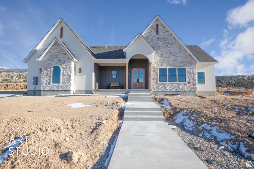 This brand-new 4,700 sq. ft. home on  acre brings the warmth of a European cottage to the wide-open beauty of country living. Surrounded by mountain views, open skies, and a welcoming community, it offers the perfect setting to enjoy quiet evenings, starry nights, and a lifestyle filled with both comfort and charm. Step through the arched double front doors, and you'll notice the thoughtful design details that set this home apart. Arches flow throughout the house, adding elegance to the spaces for a timeless European look. The kitchen with it's perfect blend of style and function opens to the dining and living rooms,with soaring vaulted ceilings and a wall of sliding glass doors invite you to gather, entertain, or simply soak in the view. The owner's suite is a retreat of its own, with vaulted ceilings and barn door leading to a spa-inspired bath featuring tile floors, a soaking tub, and a walk-in shower. The basement is ready for expansion and is already roughed in for a 2-bedroom apartment with private entrance-perfect for multi-generational living or rental income. Outdoors, copper accents and landscaping add to the home's curb appeal, while the half-acre lot offers room to breathe, with sprinklers, secondary water, and even animal rights. With $20,000 in builder and financing incentives, this home is more than just elegant-it's an invitation to live a slower, more peaceful life with European charm at every turn. Seller Financing available for qualified buyers starting at 4.9%.