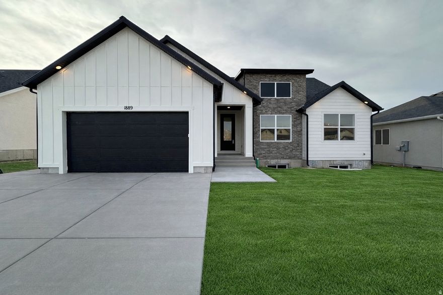 The Chelsea by GTM Builders is now offered with up to $24,000 in incentives! This beautifully designed rambler sits on a .16-acre lot in Tooele and features 6 bedrooms, 3 bathrooms, and a 2-car garage. With 3,181 total square feet, this home includes a 100% finished basement, providing ample space for living, entertaining, or multi-generational needs. Front landscaping is included, adding to the home's curb appeal. A fantastic opportunity to own a spacious, thoughtfully designed home with exceptional value don't miss it! Call/Text Shirley Tanner with questions 385-628-8161.